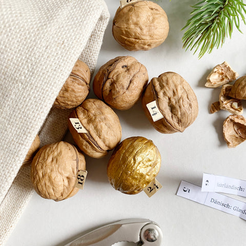 DIY Walnut Advent Calendar treasuring "Merry Christmas" in 24 Languages